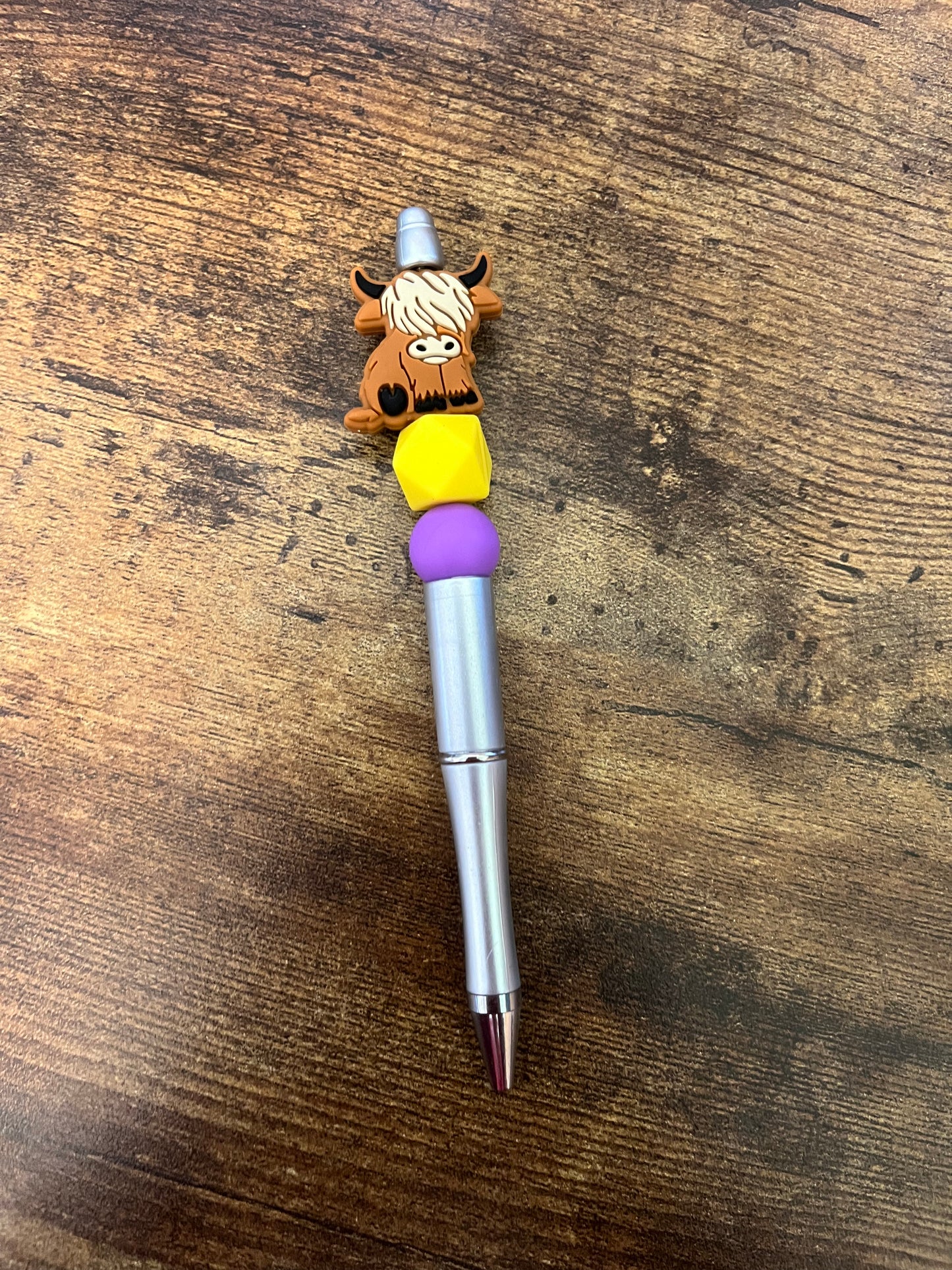 Yellow and purple highland cow pen