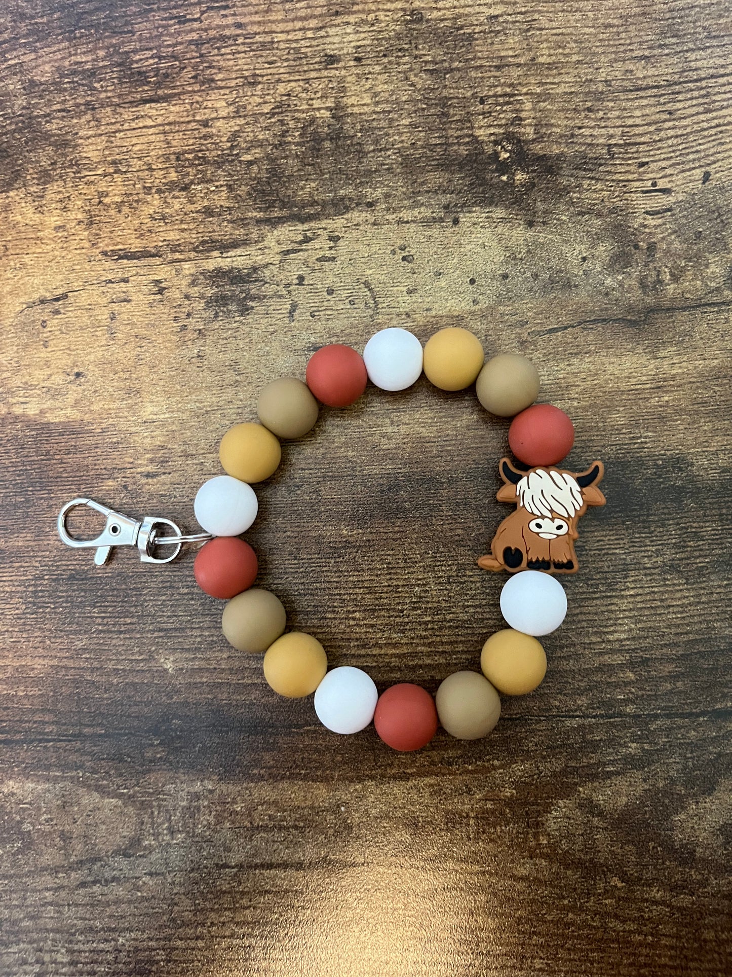 Neutral highland cow wristlet keychain