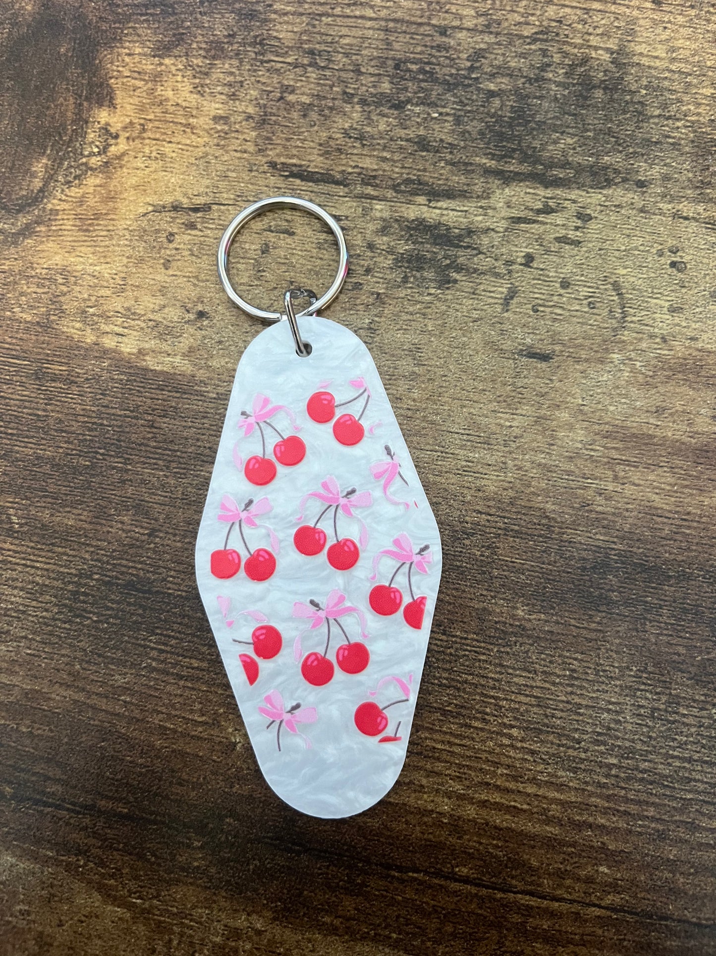 Bow cherries hotel keychain