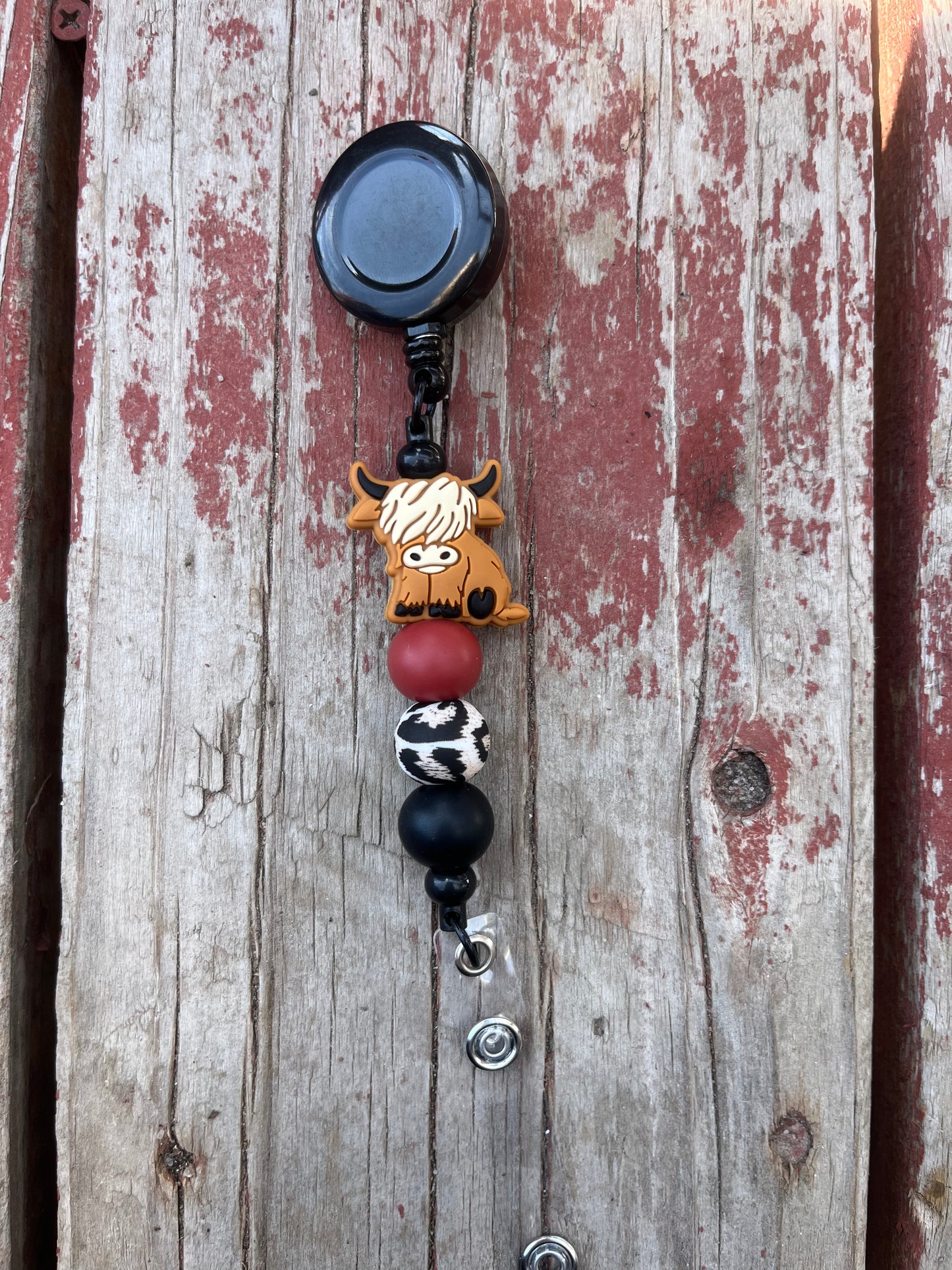Red highland cow badge reel