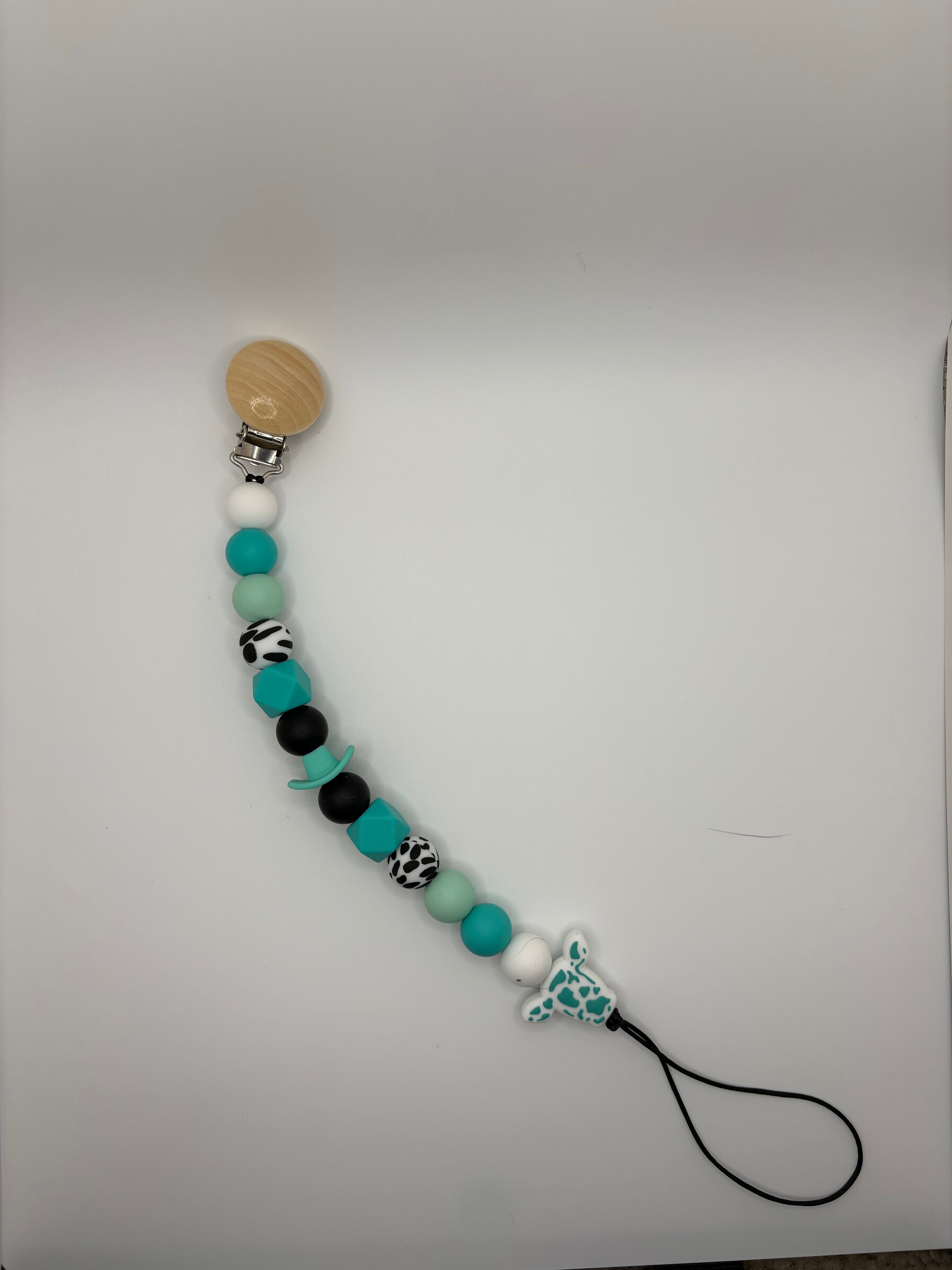 teal cow binky clip