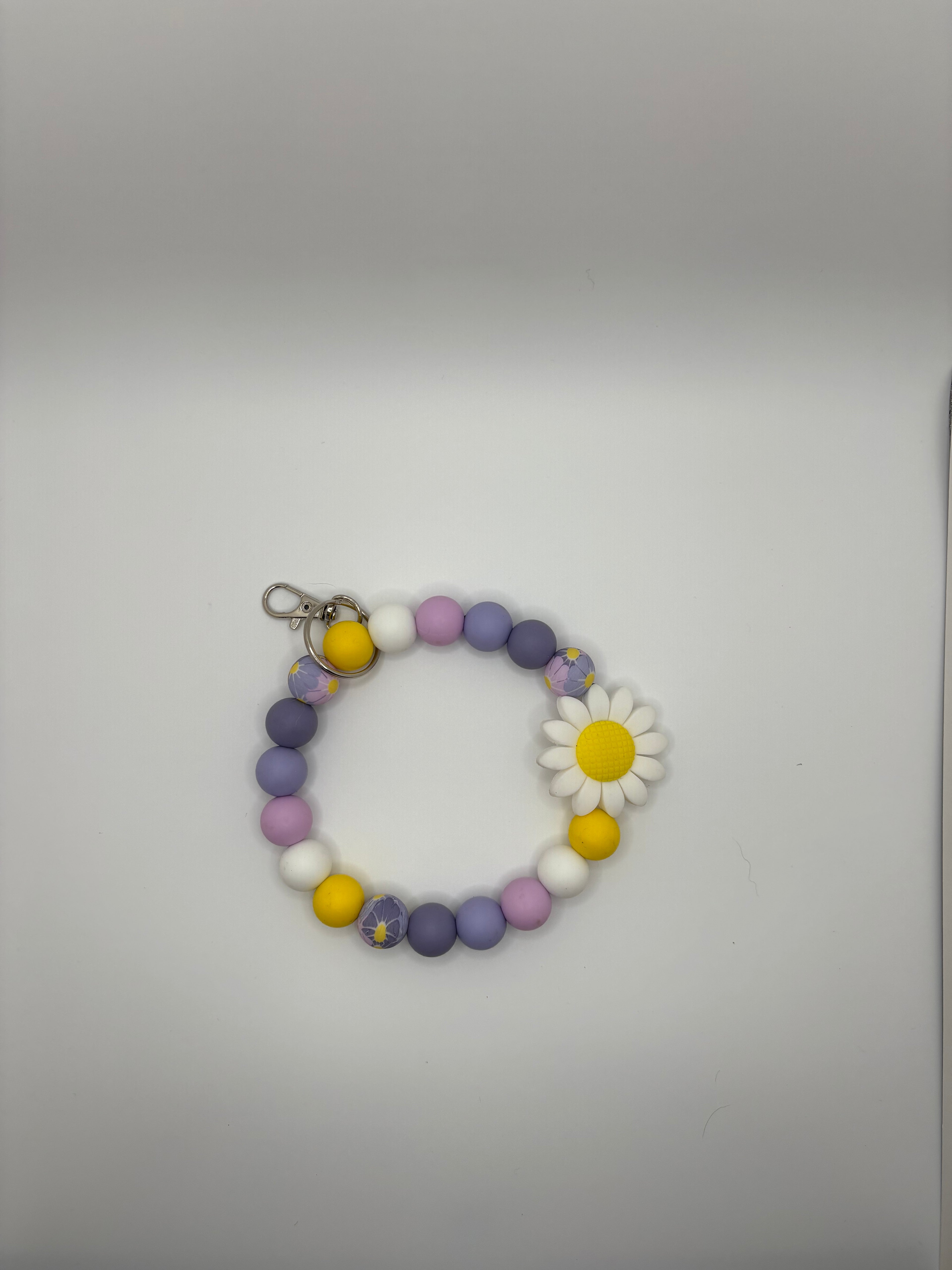 purple daisy wristlet