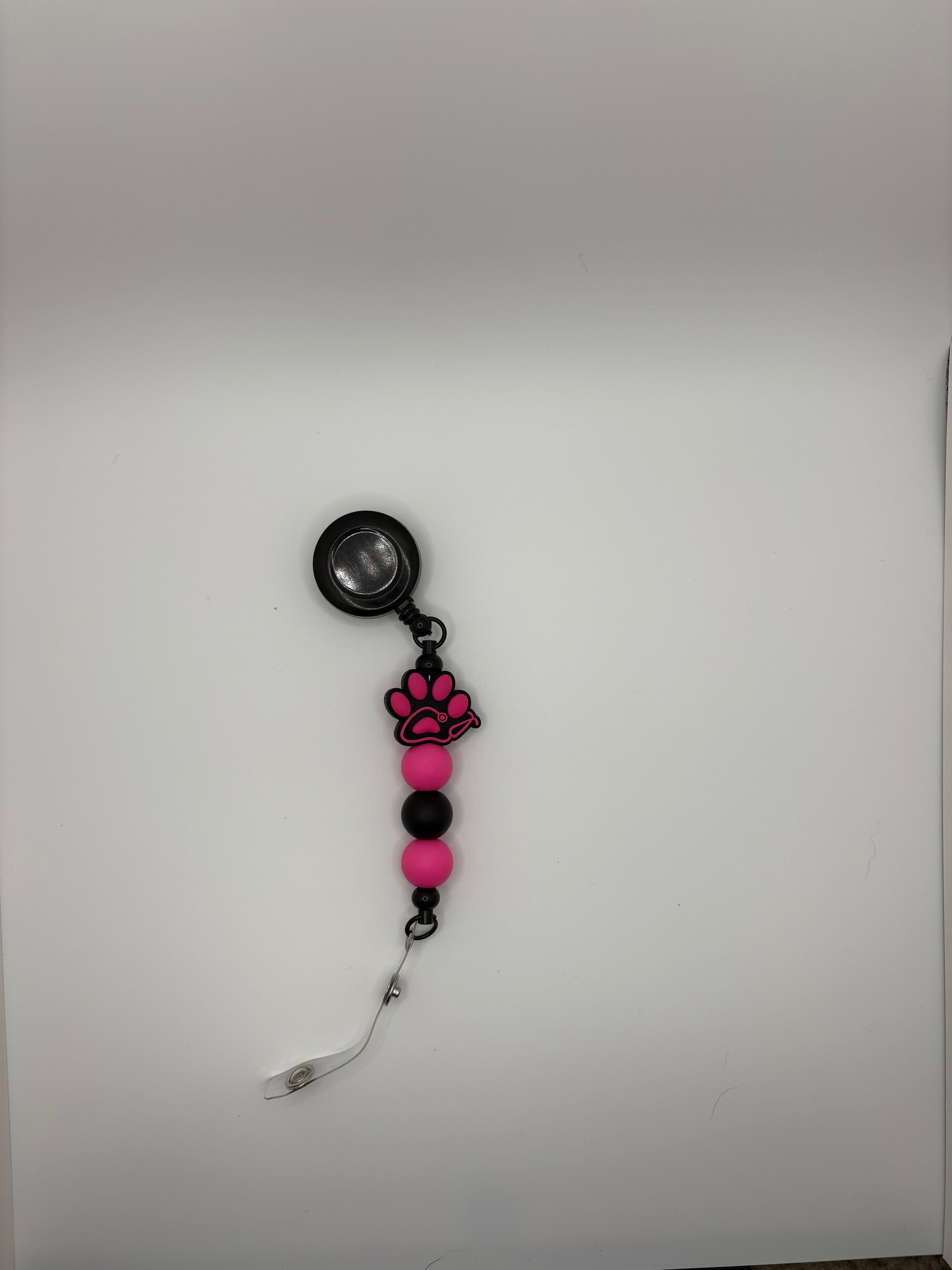 pink dog paw stethoscope badge reel