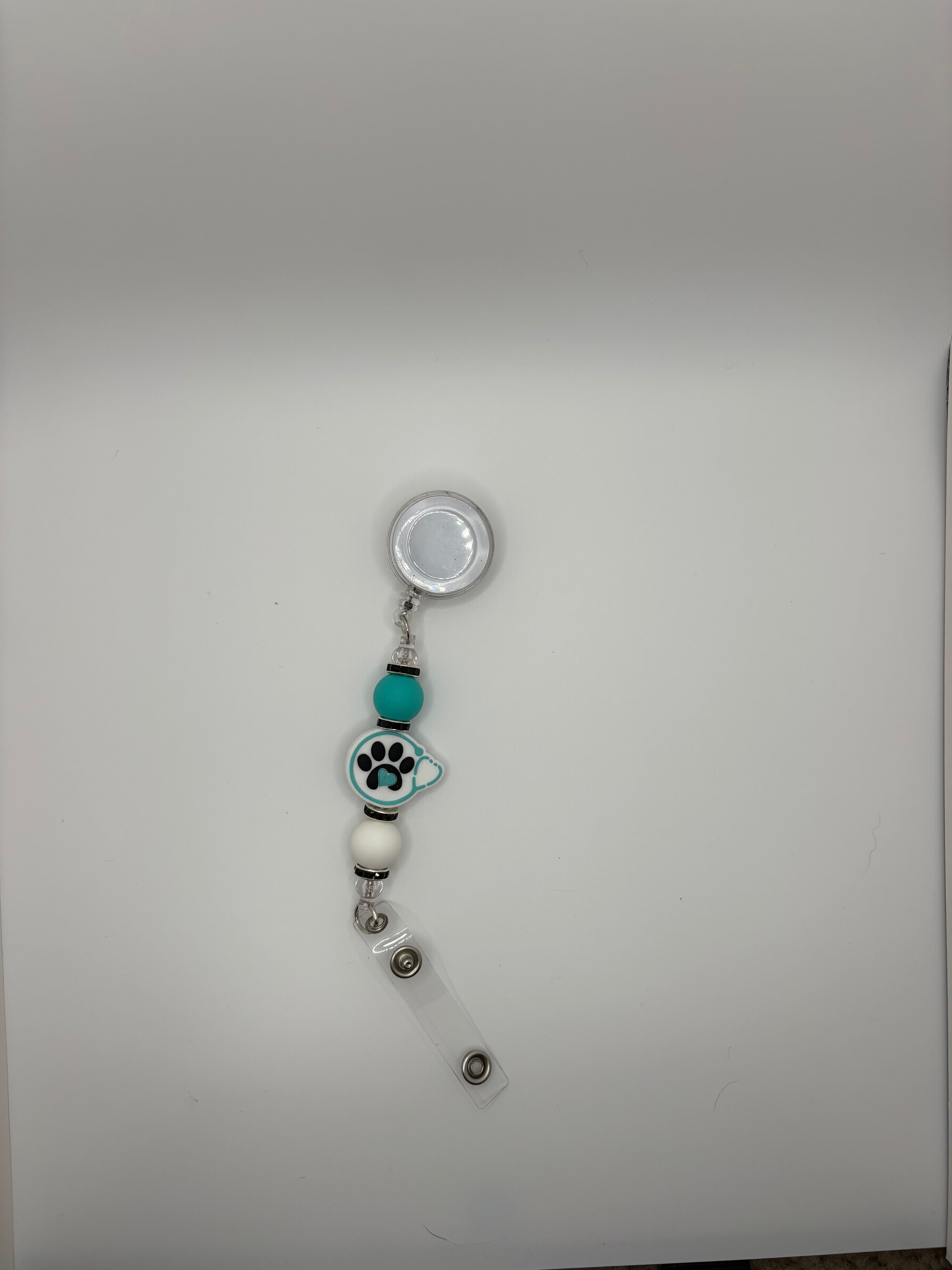 teal paw stethoscope badge reel