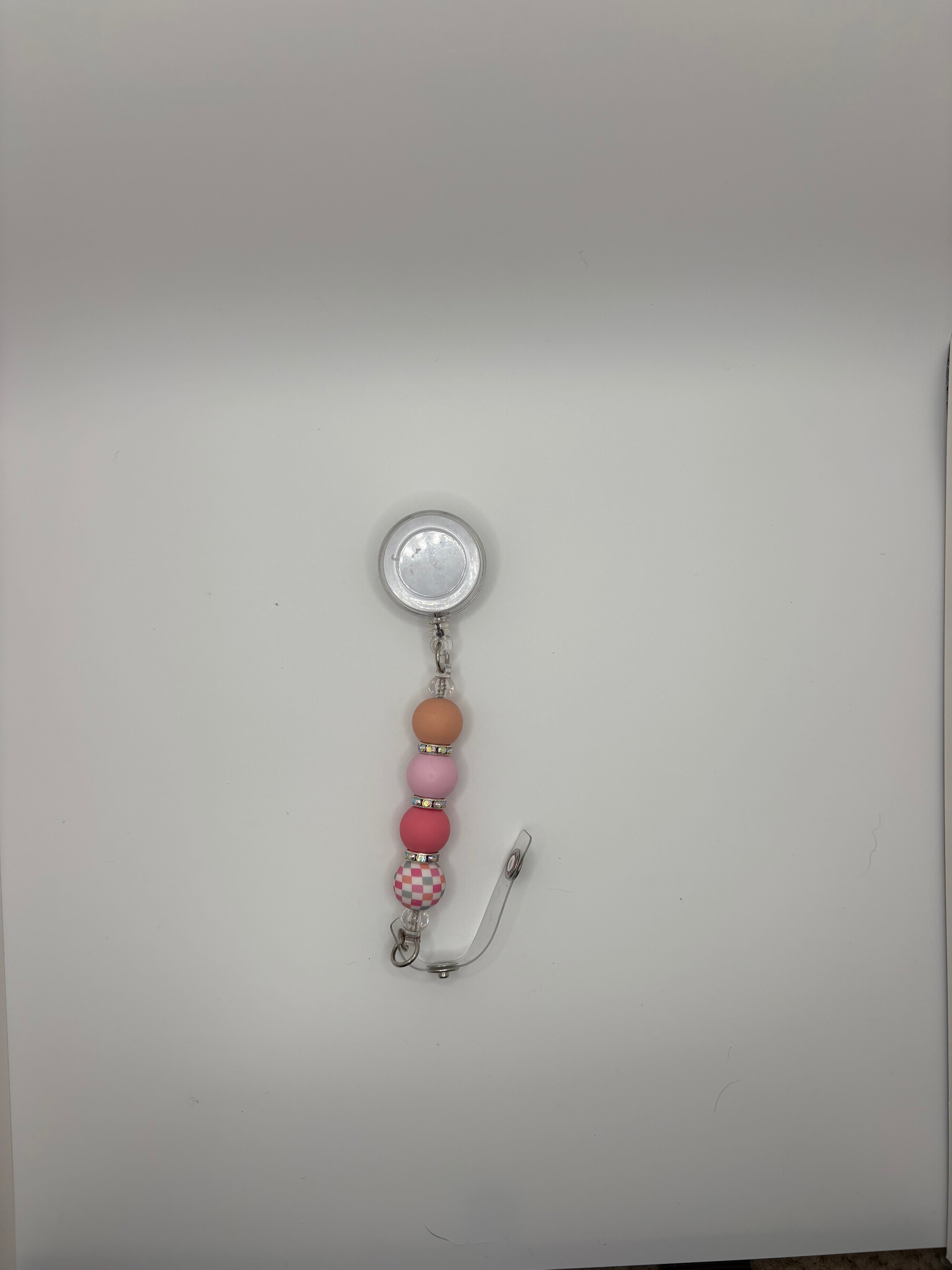 pink checkered badge reel