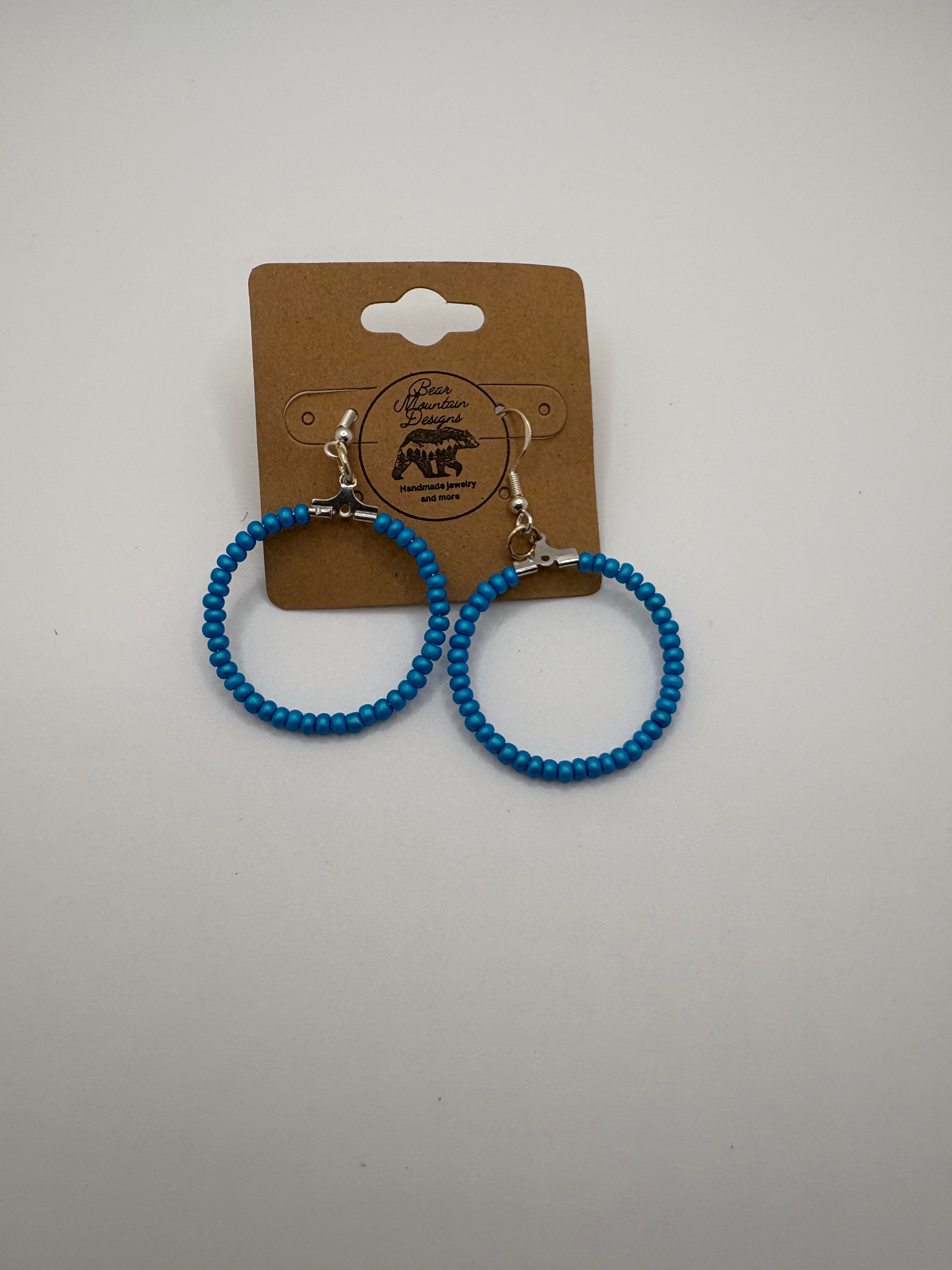 mud on the tires earrings