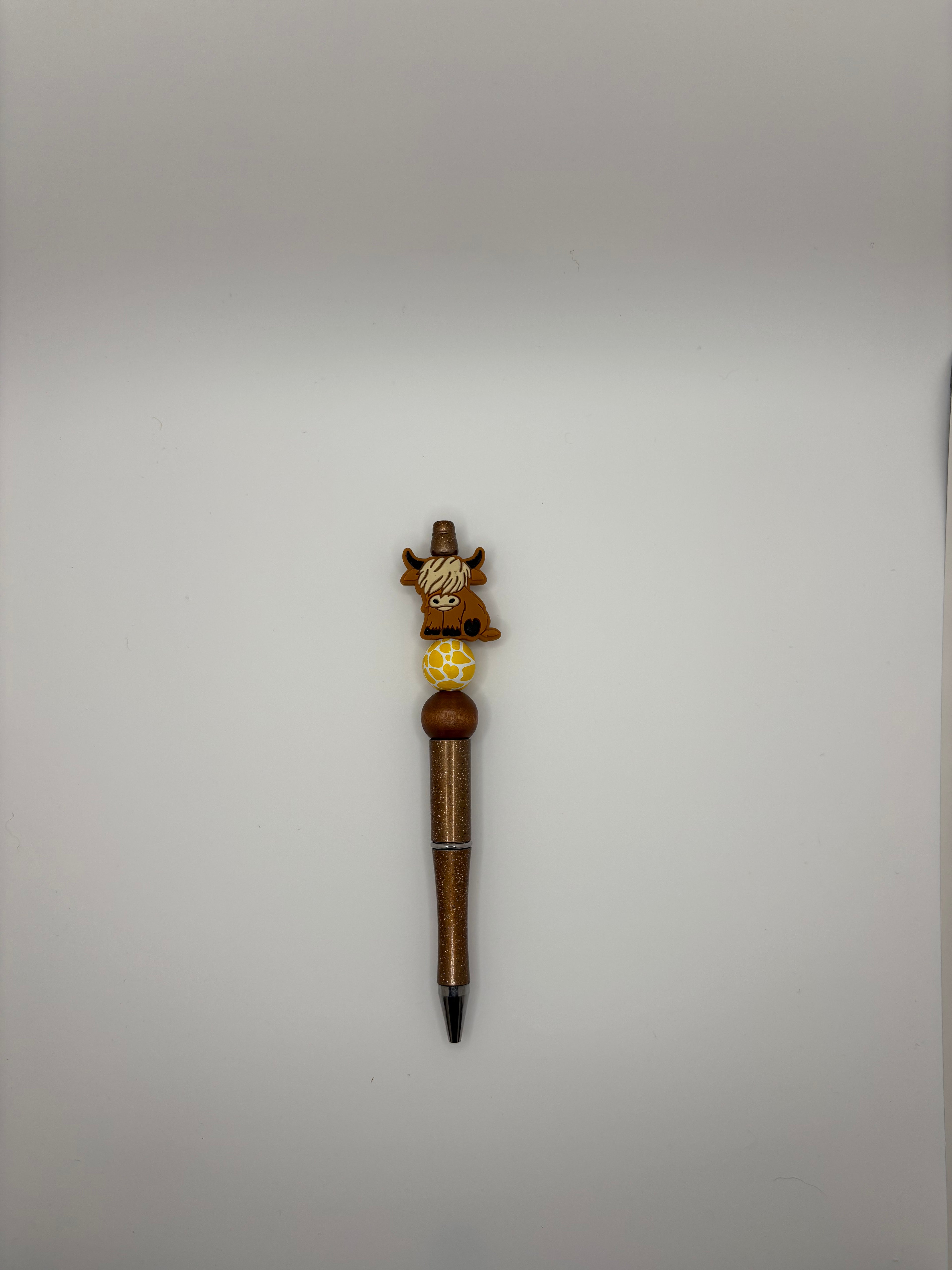 dark brown highland cow pen